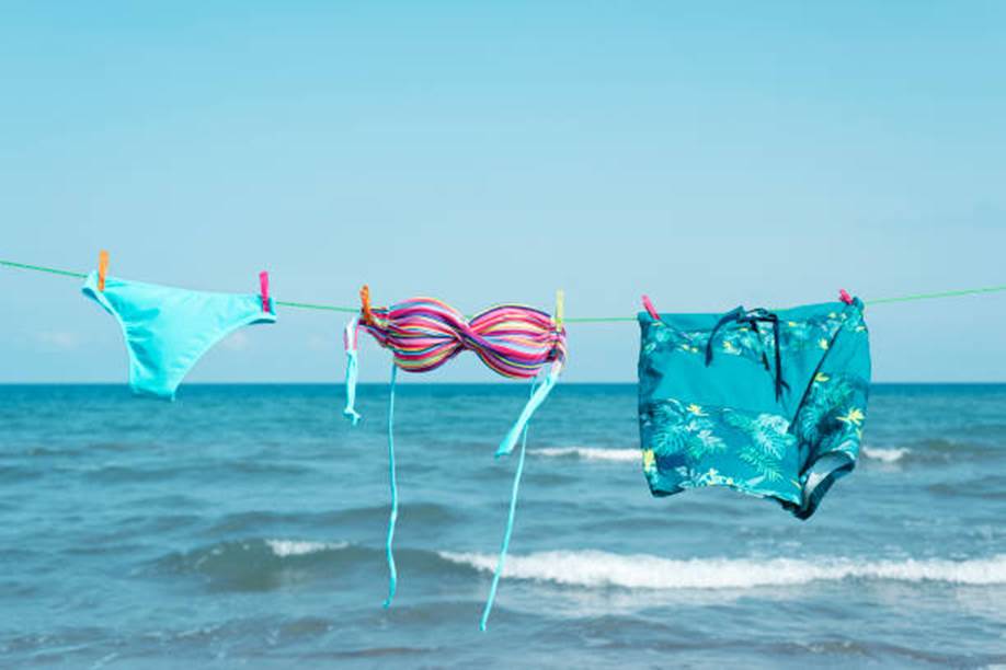 Textured swimwear; Metal badges